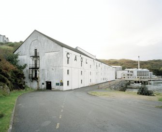 Islay, Caol Ila Distillery.
View of distillery from SSE, with bonded warehouse occupying the S end of the distillery complex in the foreground