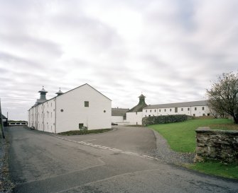 Ardbeg Distillery
General view from N of central part of distillery, showing E block of floor maltings and kilns (left) and W block of maltings (right).  The E pair of kilns have been converted into a Visitors' Centre, shop and cafe.