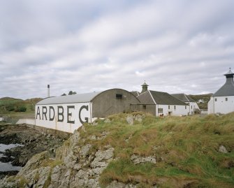 Ardbeg Distillery
View from E of S (seaward) side of distillery, showing bonded warehouse bearing the name 'ARDBEG' in large letters, designed to catch the eye of passing ferry passengers