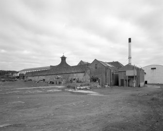 Ardbeg Distillery
General view from SW of W side of the distillery, showing the working production buildings, recently brought back into use after a silent period and a takeover by Glenmorangie.