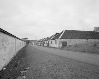 Islay, Port Ellen Distillery
View from E along the Oa road, showing bonded warehouses on either side