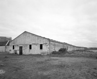 Islay, Port Ellen Distillery
View from SW showing seaward side of the S block of bonded warehouses, situated at the E end of the distillery