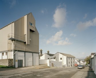 Bowmore Distillery
Oblique view from SW along SE side of distillery, overlooking School Street, with working floor maltings in middle distance, and grain store in foreground