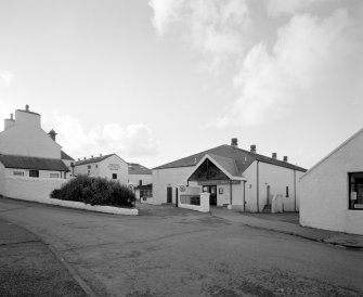 Bowmore Distillery
General view of main entrance to distillery from NE, showing the adjacent indoor Bowmore Swimming Pool (right), which is heated using waste heat from the distillery