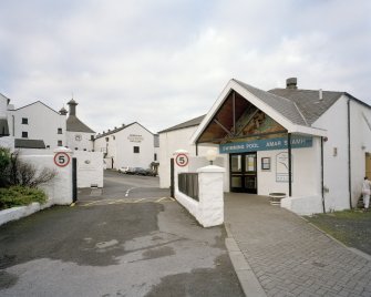 Bowmore Distillery
View of main entrance to distillery from NE, showing the adjacent indoor Bowmore Swimming Pool (right), which is heated using waste heat from the distillery