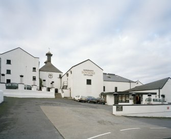 Bowmore Distillery
View from NE across E yard of distillery, showing NE side of maltings and kilns, the mash house and tun room, and (right) the visitors' centre.  Bowmore distillery is one of only two distilleries on Islay that continues to floor-malt its barley