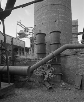 Newtongrange, Lady Victoria Colliery, Boiler House and Chimney (Original Boiler House)
Detailed view from NE of steam main (foreground), with two riveted fabricated steel pressure vessels situated in front of base of boilerhouse chimney.  The headframe can also be seen in the distance (left)