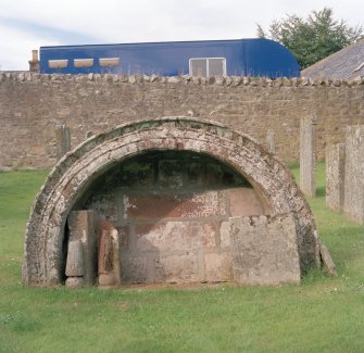 Churchyard, mural tomb, view from S