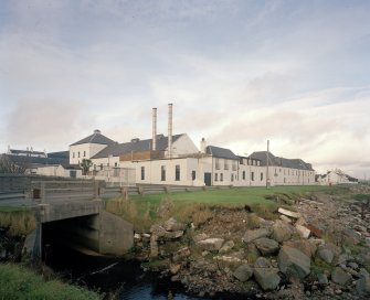 Islay, Bruichladdich Distillery
General view of distillery from SE after it became 'silent' in the mid-1990s.  In order to prevent irreversible decay, a small batch of whisky is made every year to keep the plant in working order