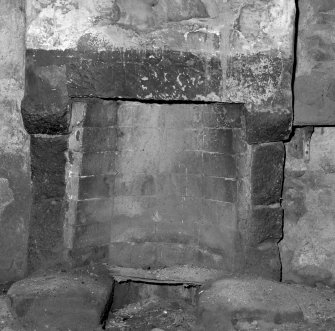 Detail of fireplace in farmhouse kitchen.