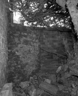 View of turret with stair in wall to North West of house.