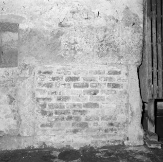 Ground floor, garden room, interior detail of blocked fireplace.