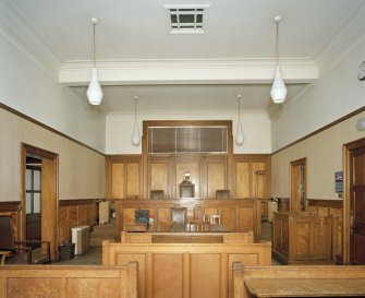 Interior.
Courtroom.