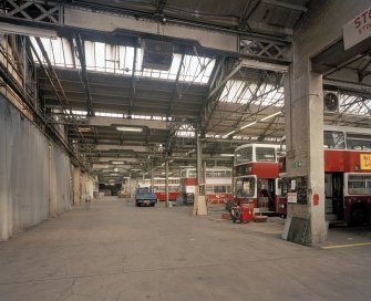Edinburgh, Leith Walk, Shrub place, Shrubhill Tramway Workshops and Power Station
Interior view from south east within Body Shop, showing central aisle (left) down which a traverser moved, inserting trams into the bays (right).  Since the disappearance of trams in the 1960s, the depot has been occupied by buses, and the traverser and tram rails have been removed