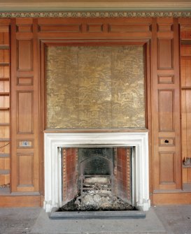 First floor, library, fireplace and embossed leather panel above, detail