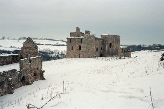 Excavation photograph : castle from SE and stable block.