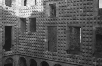 Excavation photograph : part of Italianate facade of N range showing nail head decoration.
