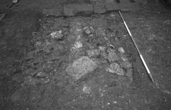Excavation photograph : sondage at E end of trench of N side of courtyard showing rubble F17 and F18, from S.
