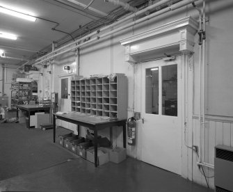Interior. View of canopied doors original entrance to worship space in North wall of main warehouse from East South East