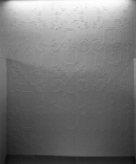 Detail of embossed ceiling paper in second floor corridor