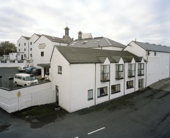 Bowmore Distillery
Elevated view from NNE showing visitors' centre and offices (foregroud), with the maltings and kilns in the background