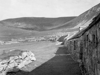 Village, Houses 12,13,14,15,16.
View from North East along street.