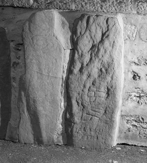 View of Knockando no.2 Pictish symbol stone and Knockando no.3 rune inscribed stone. 
 and Knockando sculptured stone no. 3