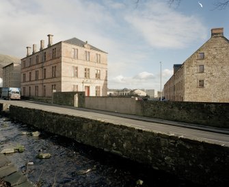 View from SW of former office (left) and mill (right) with Lower Mill Street in foreground