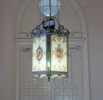Entrance porch, detail of light fitting with the initials and the coat of arms of the 11th Lord Blantyre