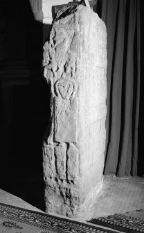View of side of the Apostles Stone cross slab on display in Dunkeld Cathedral.
