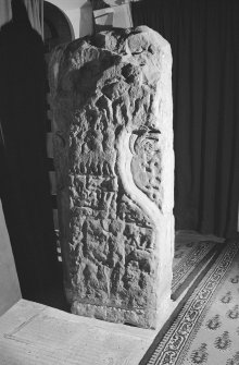 View of face of the Apostles Stone cross slab on display in Dunkeld Cathedral.