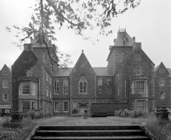 Main building. View of central entrance bay from ESE