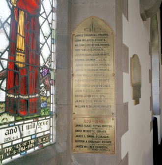 Interior, detail of war memorial in ingoe of E wall S stained glass window.