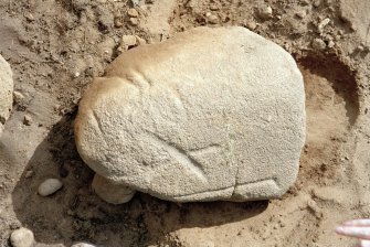 Plough-scarred stone on SW side of cairn