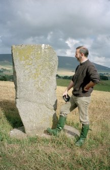 View of Craw Stane from SW; Dr Ian Fraser (RCAHMS) in picture