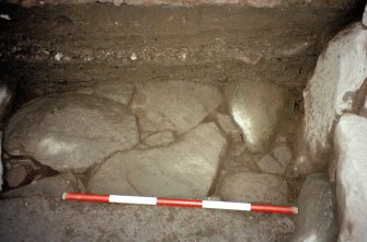 Detail of paving at NE corner of the excavation trench. Scale in 200mm divisions