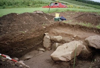 View lokking towards NE corner of the excavation trench. Scale in 200mm divisions