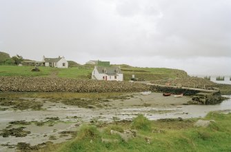 Muck, Port Mor, Pier Cottage. Cottage, gear store and quay. View from NW.