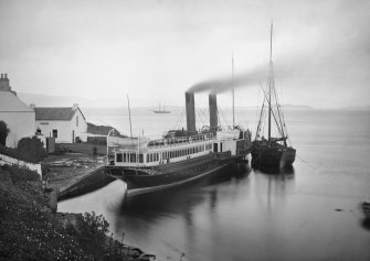 View of coaling steamship known as 'Chavalier' moored at Crinan Harbour.