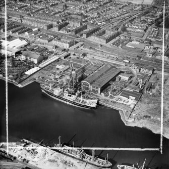 Barclay, Curle and Co, Ltd, north British Diesel Engine Works,  Whiteinch, Govan, Lanarkshire, Scotland, 1950. Oblique aerial photograph taken facing north.  This image has been produced from a crop marked negative.