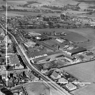 Cruikshank and Co, Ltd, Denny Iron Works, Mydub, Denny, Stirlingshire, Scotland, 1950. Oblique aerial photograph taken facing north.  This image has been produced from a crop marked negative.