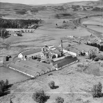 Distillery at Tomatin, Craig Morile, Moy and Dalarossie, Inverness-shire, Scotland, 1950. Oblique aerial photograph taken facing north.