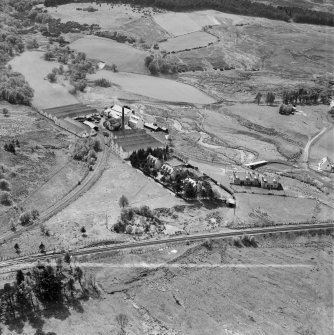 Distillery at Tomatin, Craig Morile, Moy and Dalarossie, Inverness-shire, Scotland, 1950. Oblique aerial photograph taken facing west.