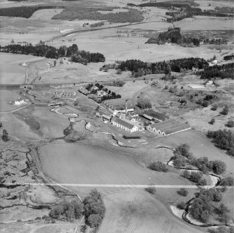 Distillery at Tomatin, Craig Morile, Moy and Dalarossie, Inverness-shire, Scotland, 1950. Oblique aerial photograph taken facing east.