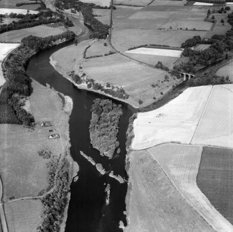 Junction of River Till and River Tweed, Tweedmill, Coldstream, Berwickshire, Scotland, 1950. Oblique aerial photograph facing north-east.