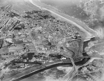 Leven, Innerleven, Wemyss, Fife, Scotland, 1929. General view, showing Aitken Street and Promenade.  Oblique aerial photograph taken facing east.  This image has been produced from a damaged negative.