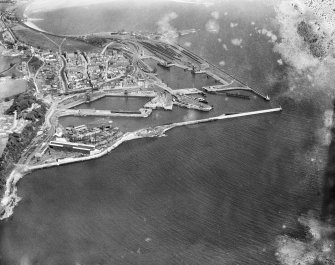 Burntisland Harbour, Burntisland, Fife, Scotland, 1929.  Oblique aerial photograph taken facing east.  This image has been produced from a damaged negative.