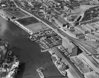 Glasgow, general view, showing Robinson Dunn and Co. Ltd. Partick Saw Mills and Meadowside Granary, Linthouse, Govan, Lanarkshire, Scotland, 1930.  Oblique aerial photograph taken facing north-west. Oblique aerial photograph  taken facing north west.