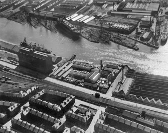 Glasgow, general view, showing Robinson Dunn and Co. Ltd. Partick Saw Mills and Meadowside Granary, Linthouse, Govan, Lanarkshire, Scotland, 1930.  Oblique aerial photograph taken facing south. Oblique aerial photograph  taken facing south.