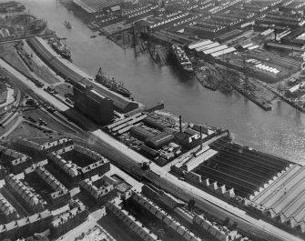 Glasgow, general view, showing Robinson Dunn and Co. Ltd. Partick Saw Mills and Meadowside Granary, Linthouse, Govan, Lanarkshire, Scotland, 1930.  Oblique aerial photograph taken facing south. Oblique aerial photograph  taken facing south-east.